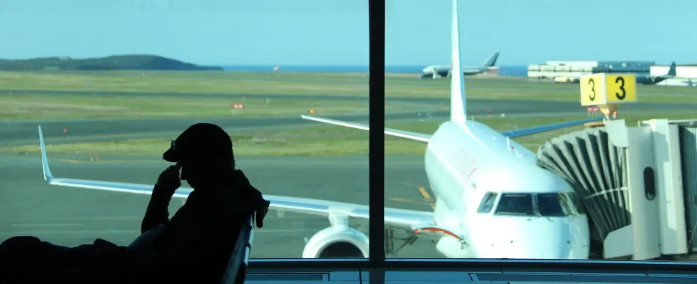 man at airport gate